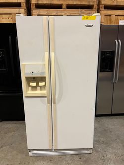 Whirlpool side by side refrigerator in white