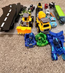 Wooden road tracks and cars and other toys