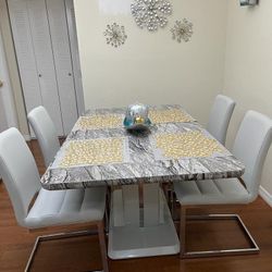 Dining set of 4 chairs, table measures 64 long x 38 wide, with very little use