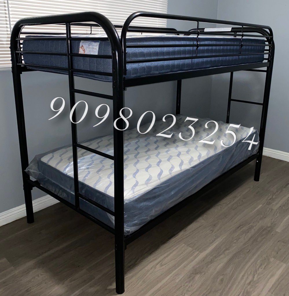TWIN/TWIN METAL BUNK BEDS W MATTRESSES INCLUDED.