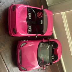 Two matching Barbie cars and Barbie driver