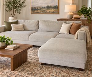 Grey Sectional with an ottoman connection