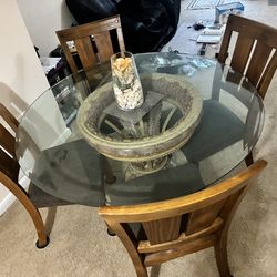 Glass round table with four chairs