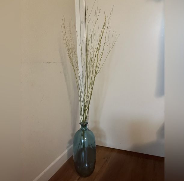 Elegant Blue Glass Vase with Natural Branches
