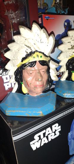 antique very heavy bookends Indian blue base white hat Indian hat I don't know the name I live downtown Lake Elsinore 92530