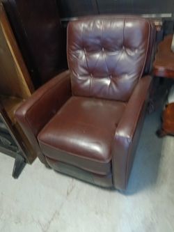 A beautiful shiny brown chair that you can relax