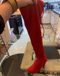 Red knee high suede boots