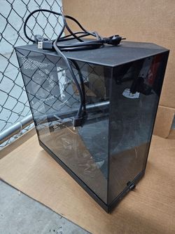 $650 Custom Built Desktop Gaming PC Tower.

Black mid-tower desktop PC with tempered glass side panel. Back panel shows USB ports, audio jacks, displa