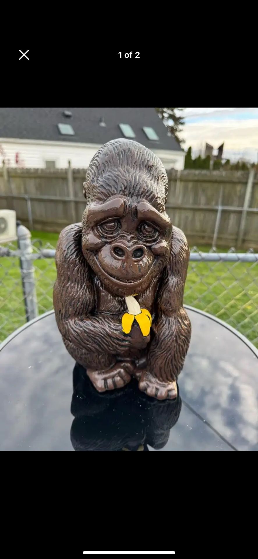 Gorilla holding banana statue