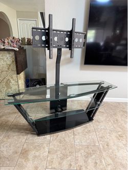Glass-and-metal TV stand with an integrated flat-screen mount