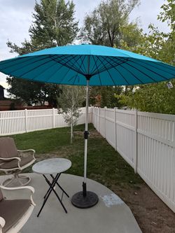 Brand new 9ft umbrella and umbrella base - can deliver.