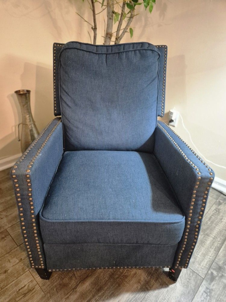 Beautiful blue armchair with studded accents