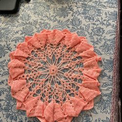 Beautiful design of handmade crochet orange doily