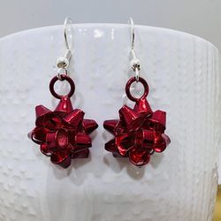 These are gorgeous red christmas bow earrings with plated Sterling Silver earring hooks . They will Make a beautiful festive addition to any