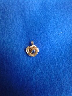 Gold plated pendant with a sapphire