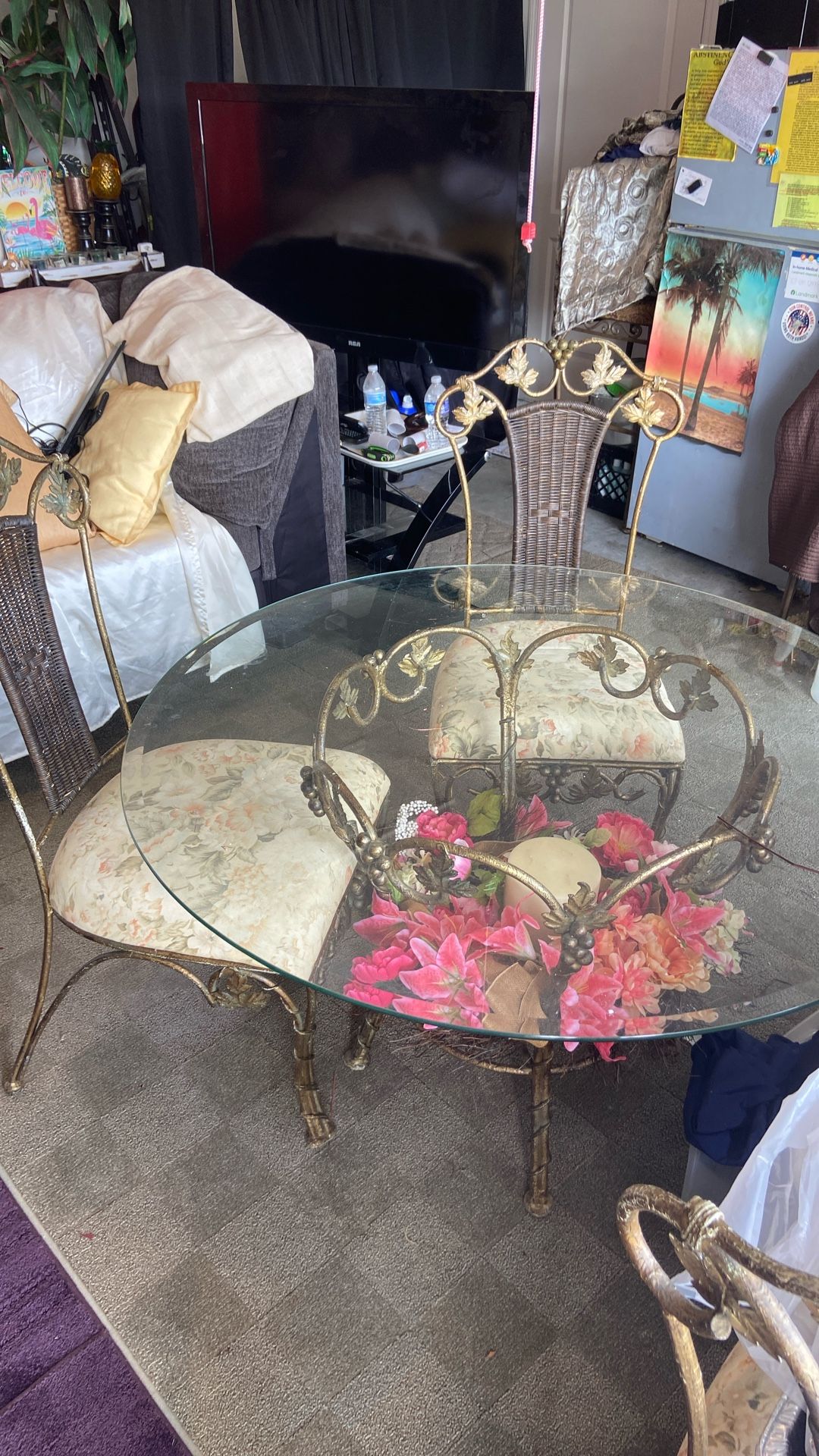 Antique Dinning Table With 4 Chairs And Floral Arrangements 