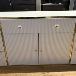 Modern White Storage Cabinet with Gold Trim