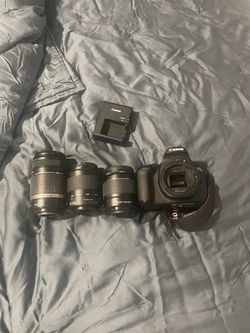 Canon t100 EOS DSLR Camera with 3 Lenses and Charger
