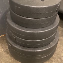 A Set Of 10, 15 And 25 LB Weights 