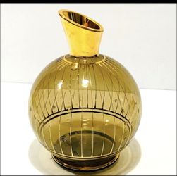 Vintage Midcentury Amber Art Glass Gold Trim Small Decanter 6.25”. Very good condition, minimal wearing marks on it.