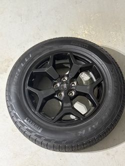 Four like new wheels and tires