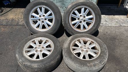 Ford Mustang 16 Inch aluminum wheels and old tires 5x4.5 Lug pattern fits Toyota Trucks
