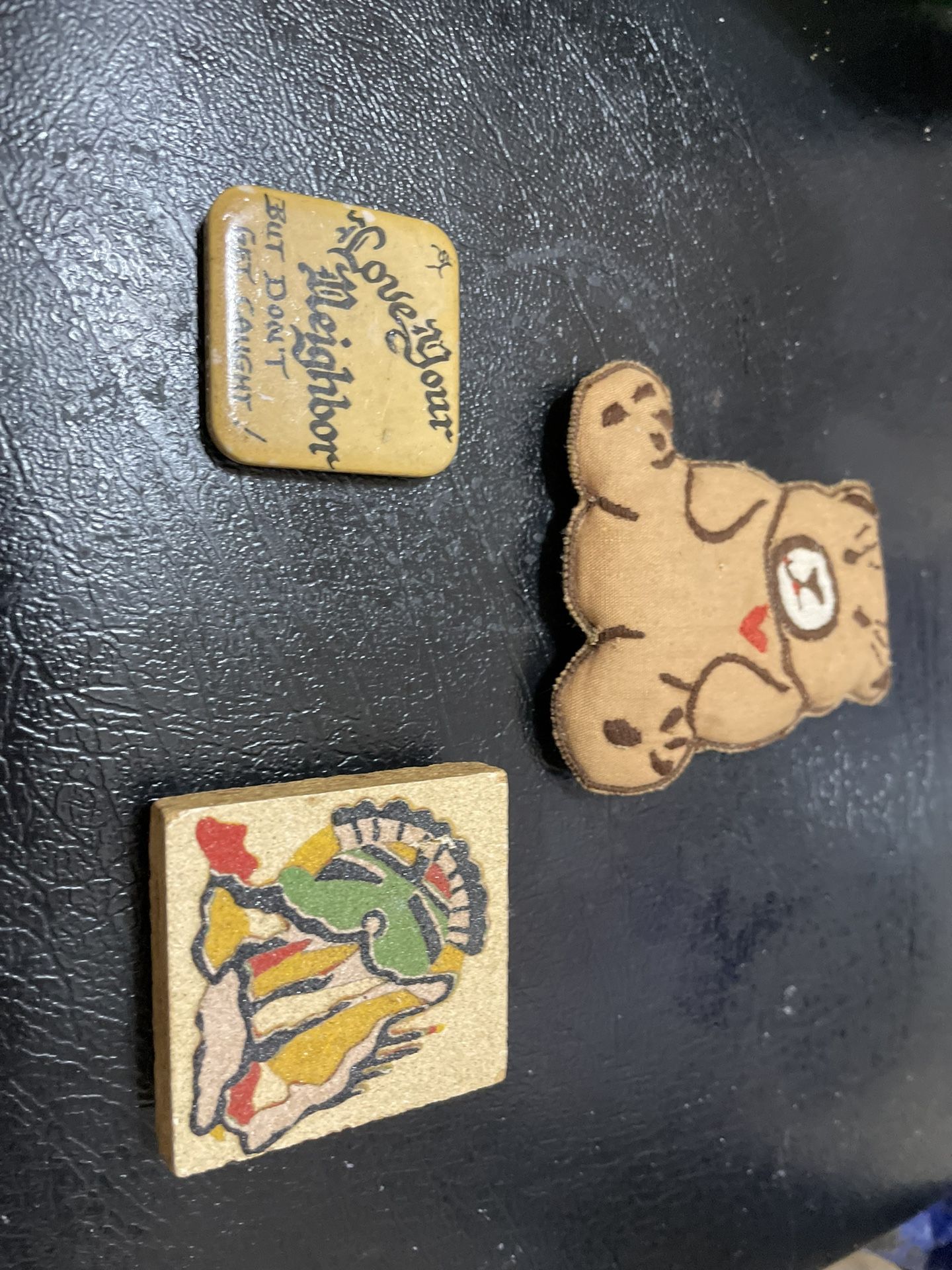 Various fridge magnets bear,Navajo, love thy neighbor
