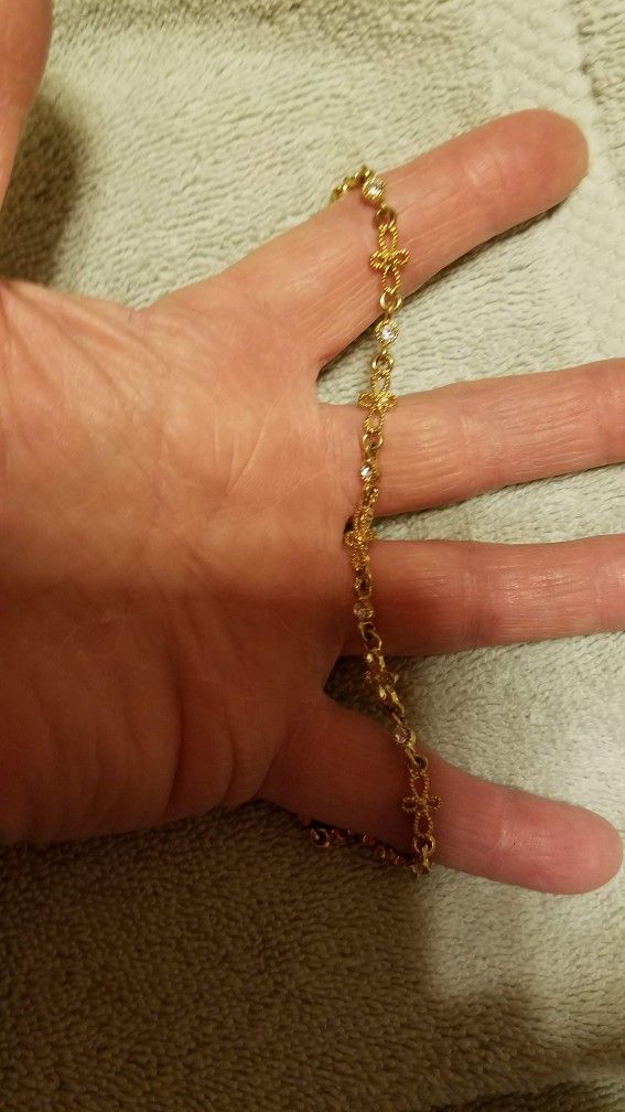 Bracket from Avon
Pretty Gold plated bracelet with a cross's and cubic Zirconia diamonds.
Please go to my page and see other items that I have liste