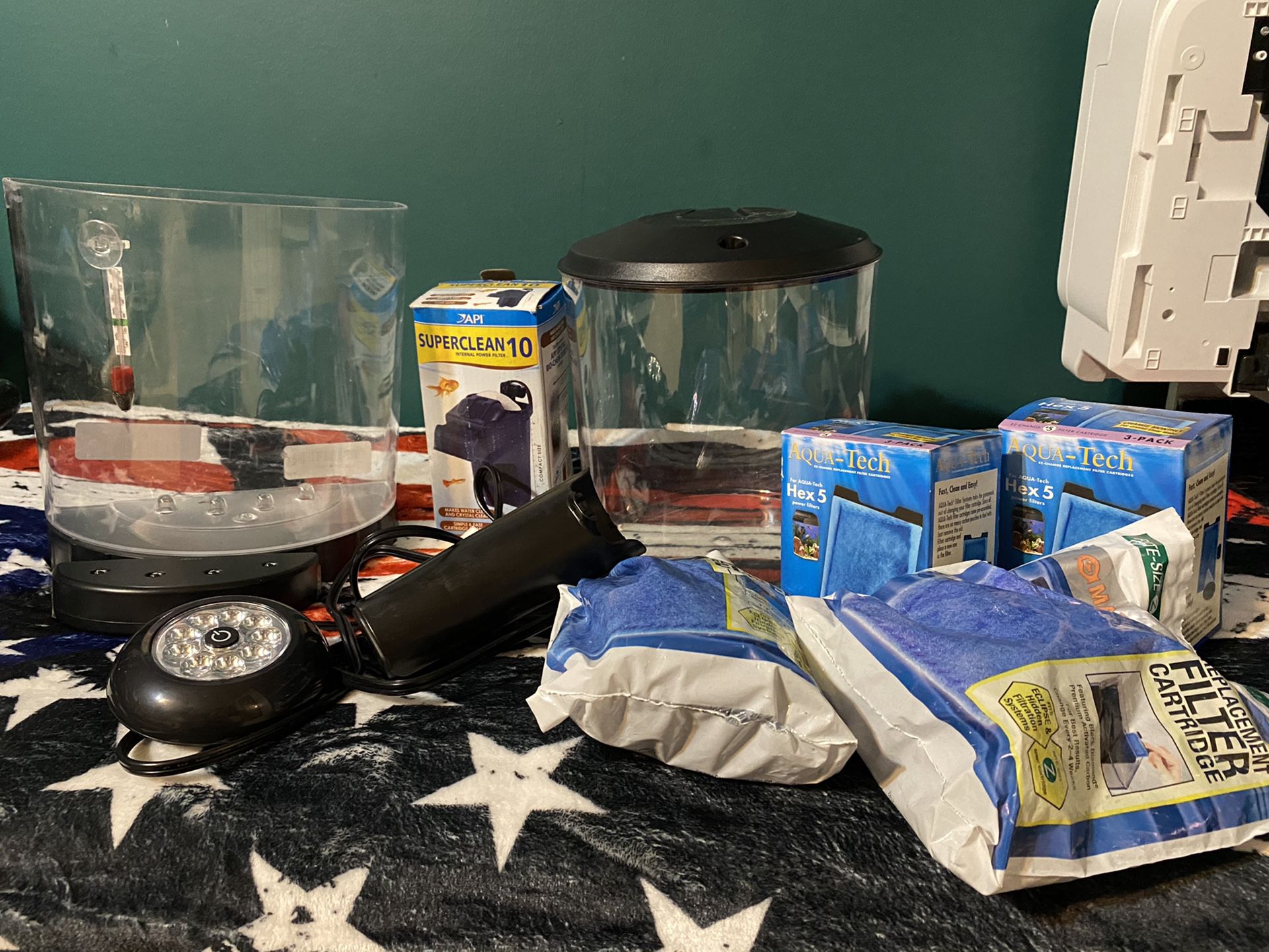 2 Fish tanks with lights, thermometer, and filters