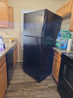 Black refrigerator. Fridge must be gone by today