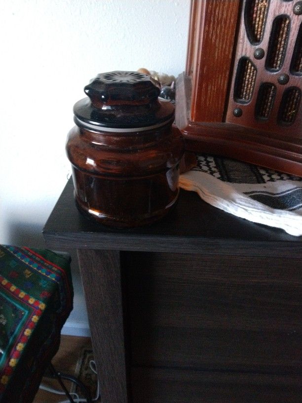 A Glass Container Dark Brown