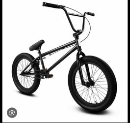 black Elite BMX freestyle bicycle (with "ELITEBMX" visible on the top tube and various decals)