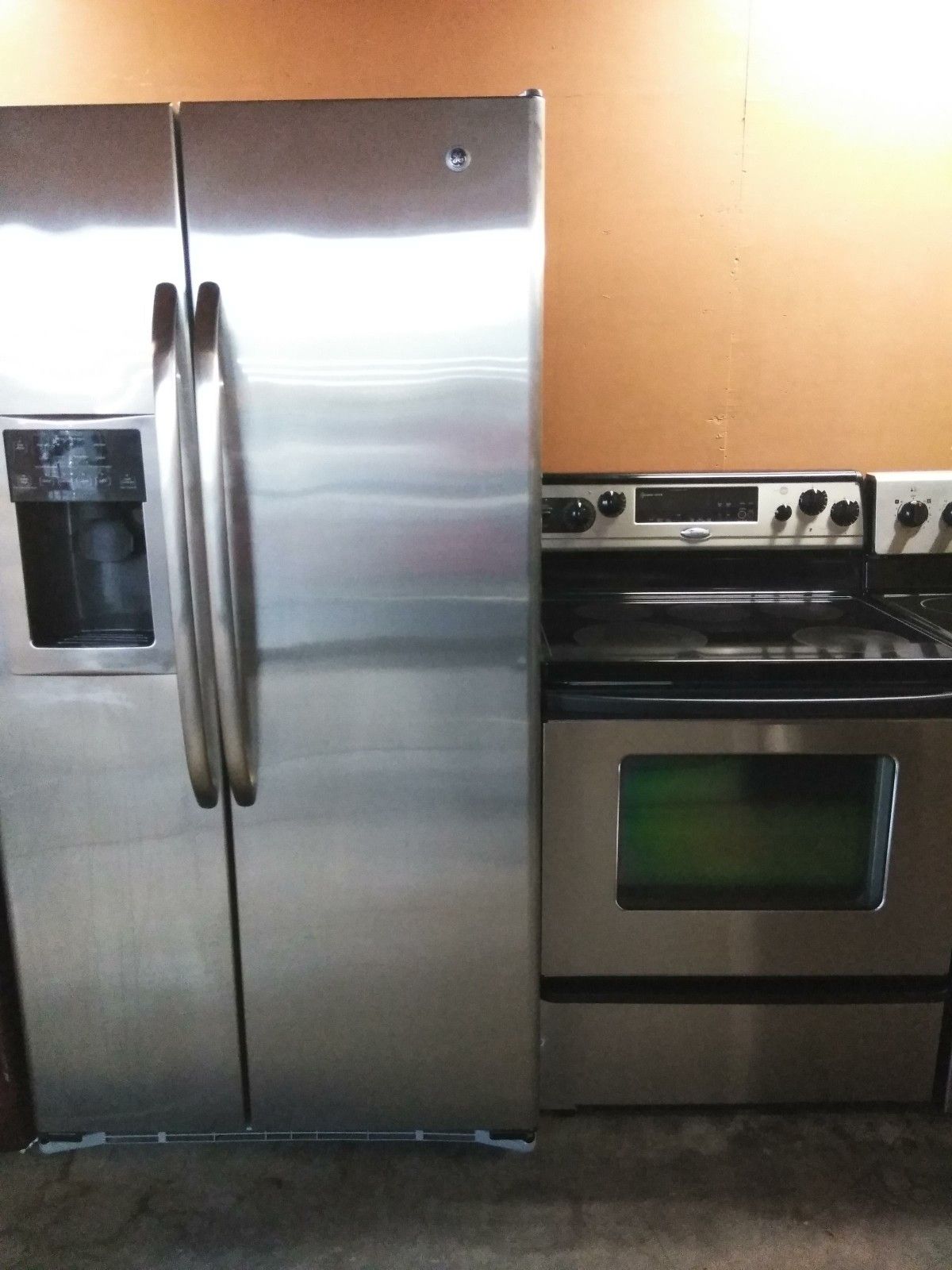 Whirlpool stainless steel refrigerator and stove