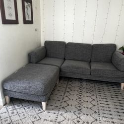 Grey Couch And Movable Ottoman 