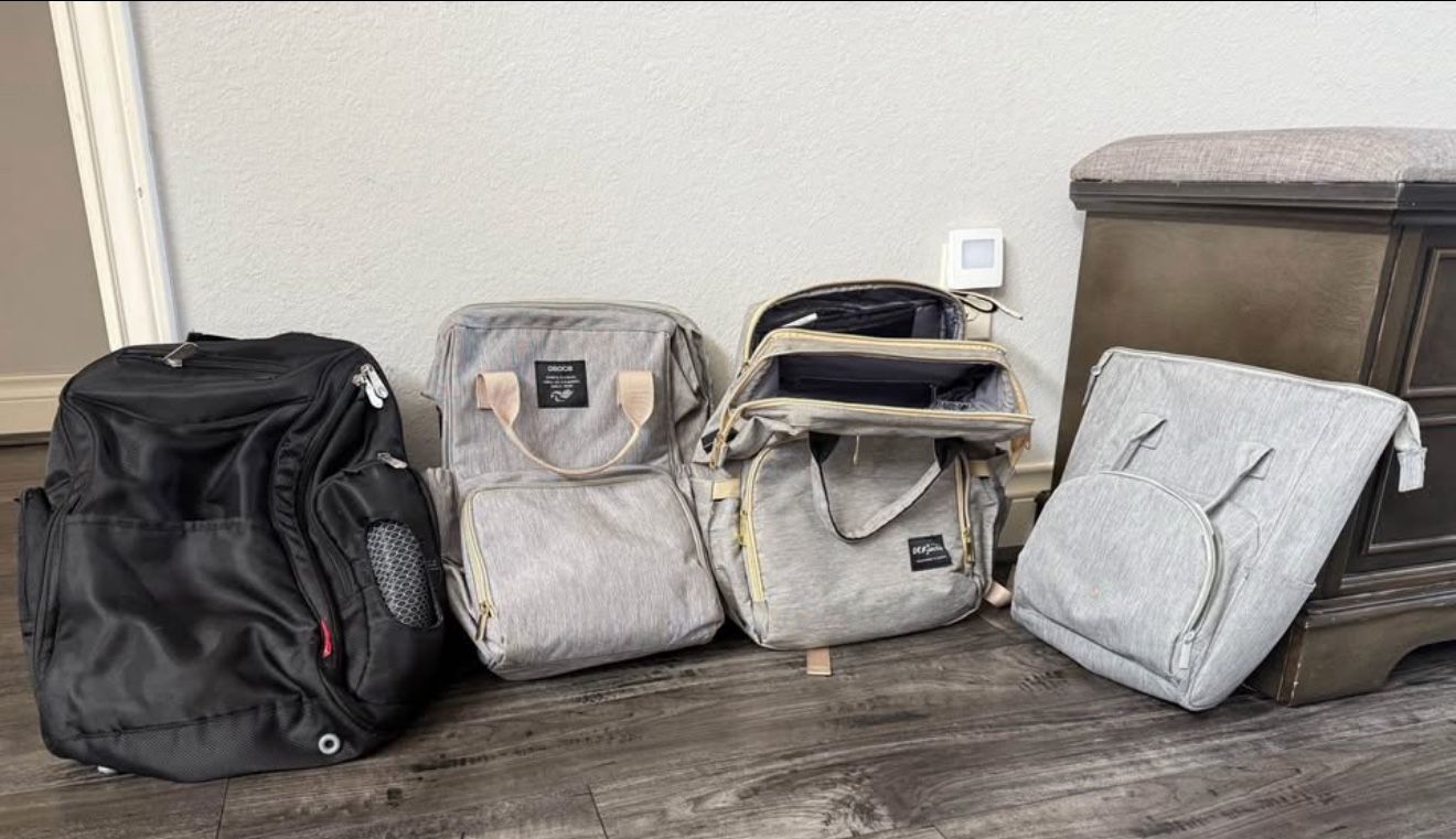 1 Brand New Diaper Bag With Diaper Changing Station, 3 Good Condition Diaper Bags 