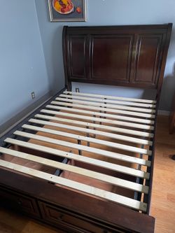 Sleigh bed with dove tailed drawers
