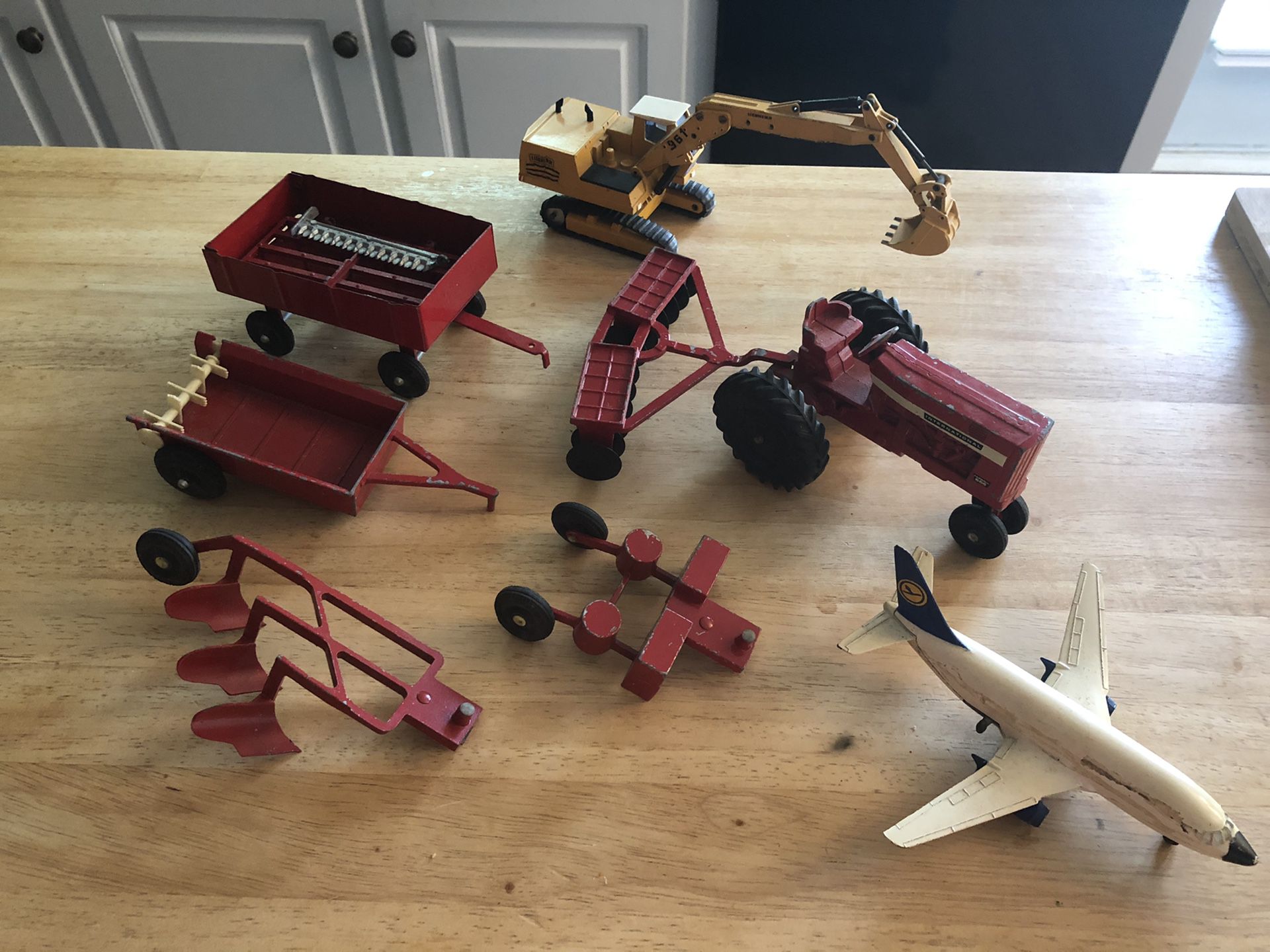 Diecast metal toys farm tractor and vintage bang cap gun holster belt