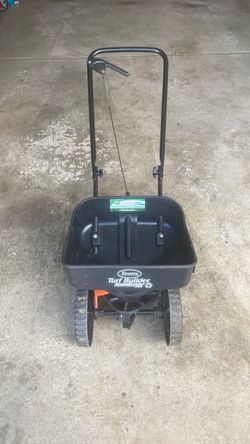 Scott’s mini spreader holds 5000 ft.² plus fertilizer like new