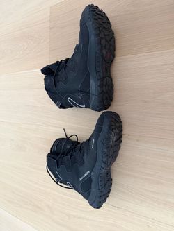 Waterproof Solomon men’s shoes size 9.5