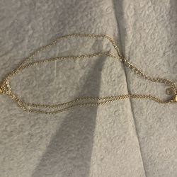 Gold Necklace With A Heart Pendant