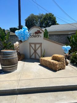 Barn backdrop for party with hay bales