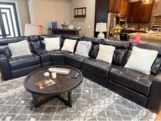 L Shape 5 Piece Leather Sectional with corner reclining chairs and full size bed.