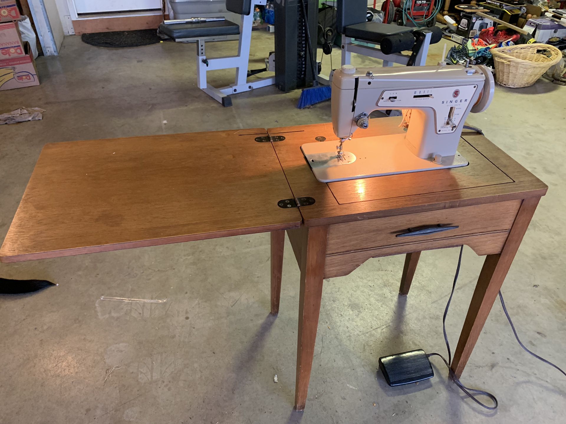 Vintage singer model 237 sewing machine in table