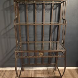 This vintage metal baker's rack and bar