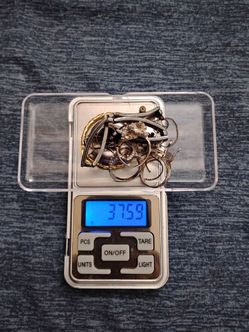 Silver 925 . . 37.59 grams . . $74 exactly melt value