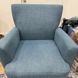 Blue armchair with throw pillows