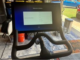 Peloton Bike with mat and shoes