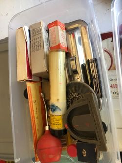 Containers of vintage dental accessories and supplies