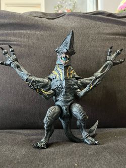 The NECA Pacific Rim Ultra Deluxe Mutavore is a highly detailed, 8-inch, Category
