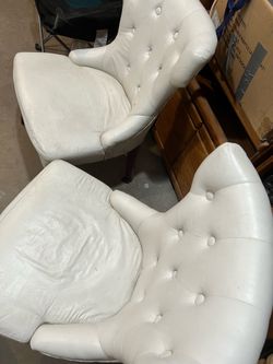 two white leather chairs